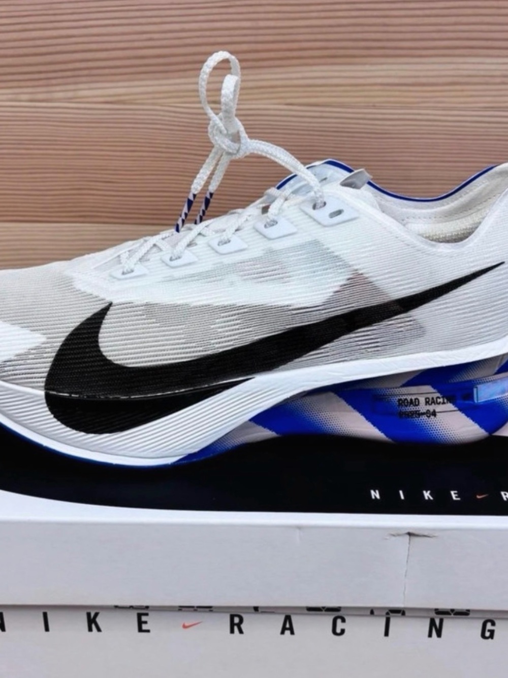 Brand-new Nike ZoomX Vaporfly NEXT% 4 CM road-racing shoes.